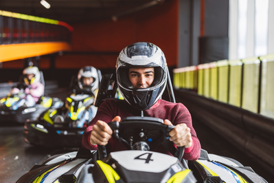 close up guy driving go kart