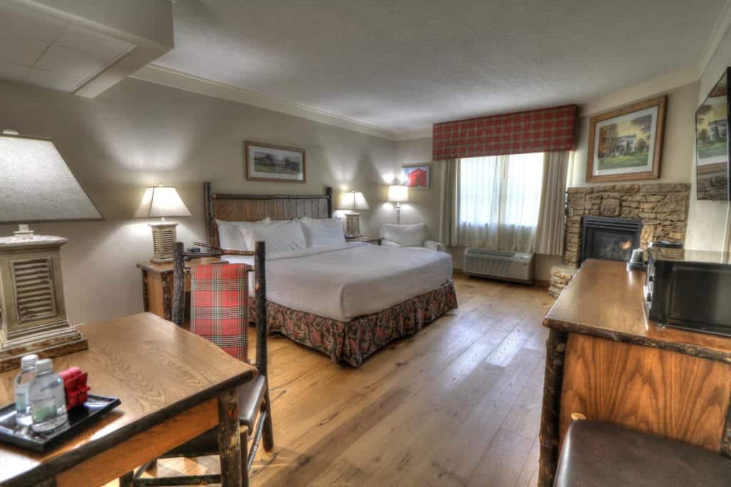 Hotel room with king bed and fireplace at hotel near Pigeon Forge Tn