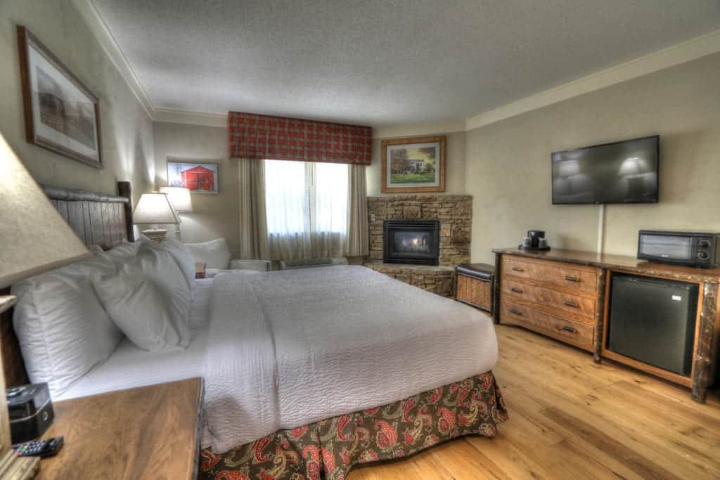 Spacious room with king bed and fireplace at Sevierville hotel