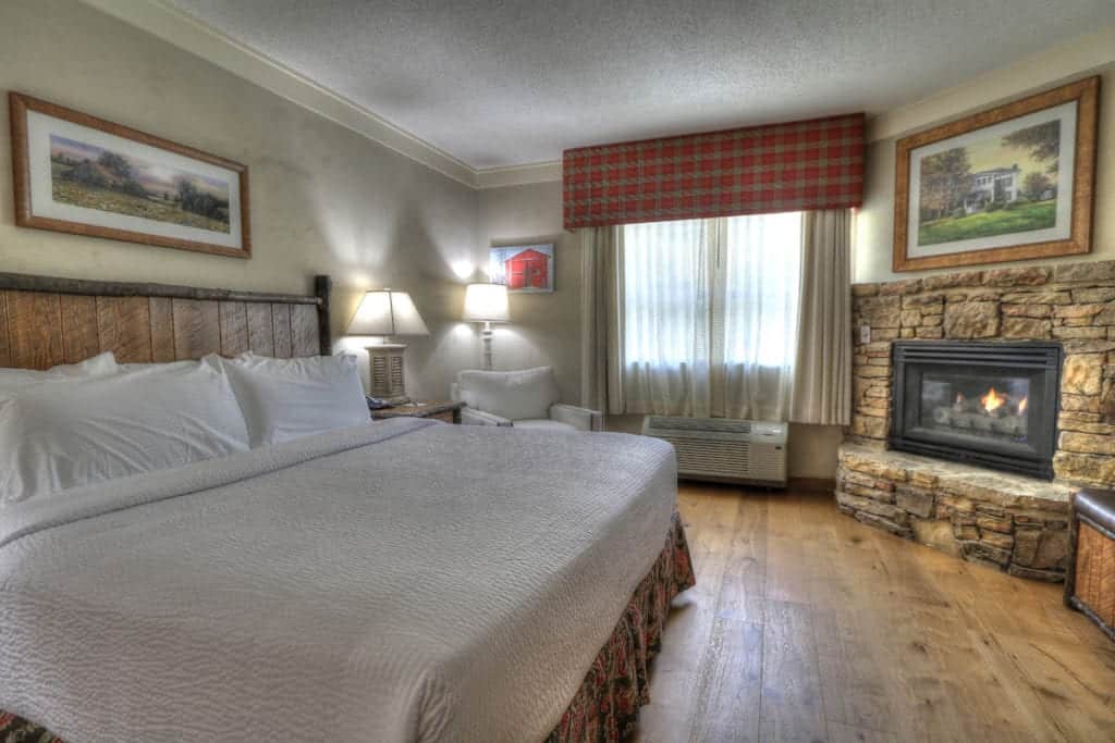 Premier room with king bed and fireplace at The Lodge at Five Oaks hotel in Sevierville Tn
