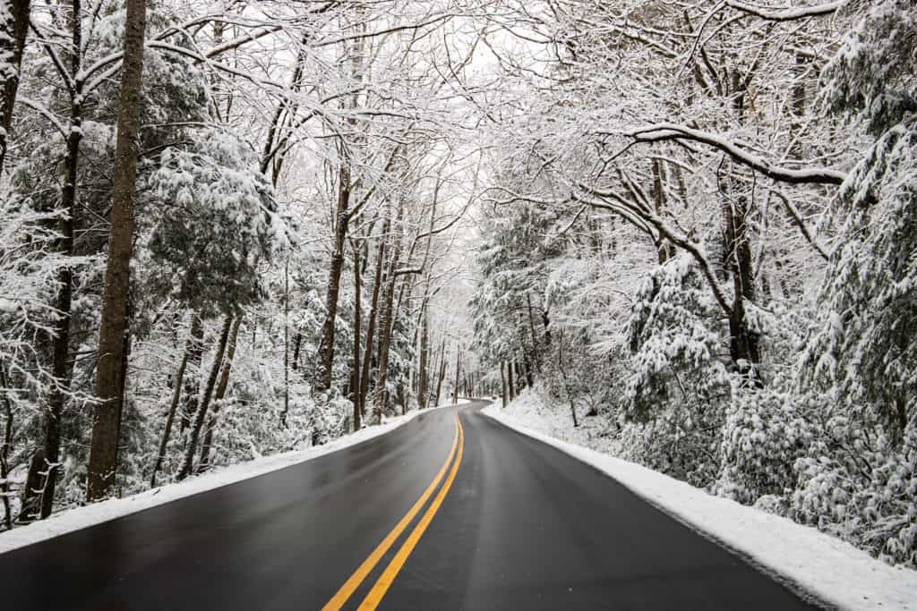 winter road in the smoky mountains covered in snow