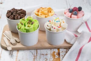 rolled ice cream of various flavors in white cups
